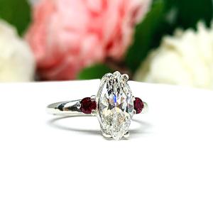 Diamond ring with ruby accents top