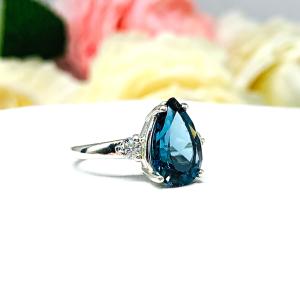 London Blue Topaz Pear Moissanite Ring - Sterling silver setting- Round moissanite side stones