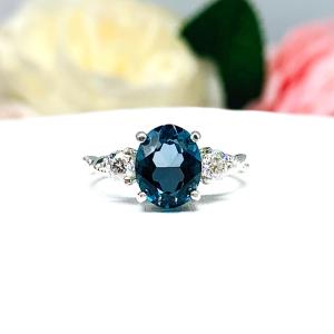 London Blue Topaz Oval Ring – 8x6mm-10x8mm, Moissanite Accents, Sterling Silver, Twist Milgrain Band