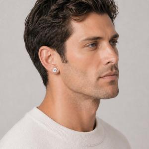 A man wearing silver stud earrings with very light yellow or "near colorless" old mine cut cubic zirconia stones. Model image for size and styling reference — not a photo of the actual earrings.