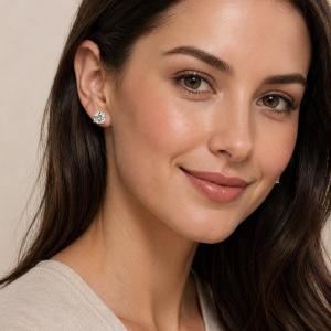 A woman wearing silver stud earrings with very light yellow or "near colorless" old mine cut cubic zirconia stones. Model image for size and styling reference — not a photo of the actual earrings.