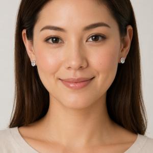 A man wearing 9x7mm oval white topaz stud earrings. Model image for size and styling reference — not a photo of the actual earrings.