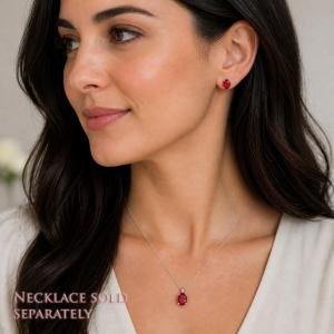 A woman wearing oval lab ruby sterling silver pendant necklace and matching earrings. 'NECKLACE SOLD SEPARATELY' appears in pink text in the image.  Model image for size and styling reference — not a photo of the actual necklace.