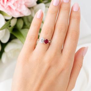 8x5mm pear CZ and 6mm round lab‑created ruby toi et moi ring in sterling silver shown worn on the hand of an AI model. Model image for size and styling reference — not a photo of the actual ring.