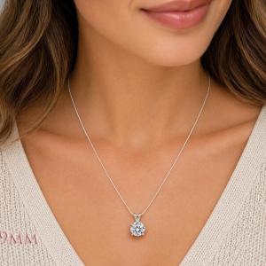 A woman wearing an 9mm round lab white sapphire sterling silver pendant necklace. Model image for size and styling reference — not a photo of the actual necklace.