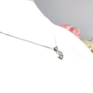 Sterling silver cluster pendant featuring four 3mm round light blue aquamarine gemstones and an elegant twist design bail. Suspended from a delicate sterling silver chain and set against a white background.