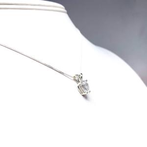 Sterling silver necklace featuring a pear-cut cubic zirconia with brilliant sparkle. The teardrop-shaped stone is inverted, creating a unique and modern look.