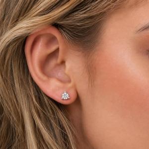 A woman wearing 6mm old european cut cz martini stud earrings. Model image for size and styling reference — not a photo of the actual earrings.