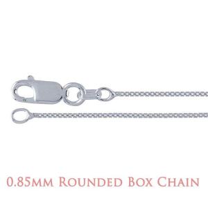 A close-up image of a delicate silver chain with a lobster clasp closure. The chain features a rounded box link design, where each small, square-shaped link has softly curved edges that create a smooth, reflective surface. The overall appearance is sleek and polished, highlighting the fine craftsmanship and subtle shine of the metal. Text at the bottom of the image reads “0.85mm Rounded Box Chain” in a soft rose-colored font.