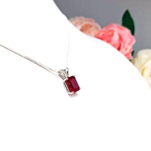 Sterling silver necklace featuring a 9x7mm emerald-cut lab-created ruby pendant in a 4-prong setting.