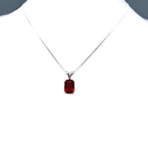Sterling silver necklace featuring a 9x7mm emerald-cut lab-created ruby pendant in a 4-prong setting.