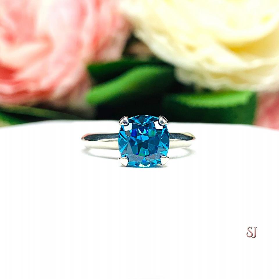 Blue topaz and clearance cubic zirconia ring