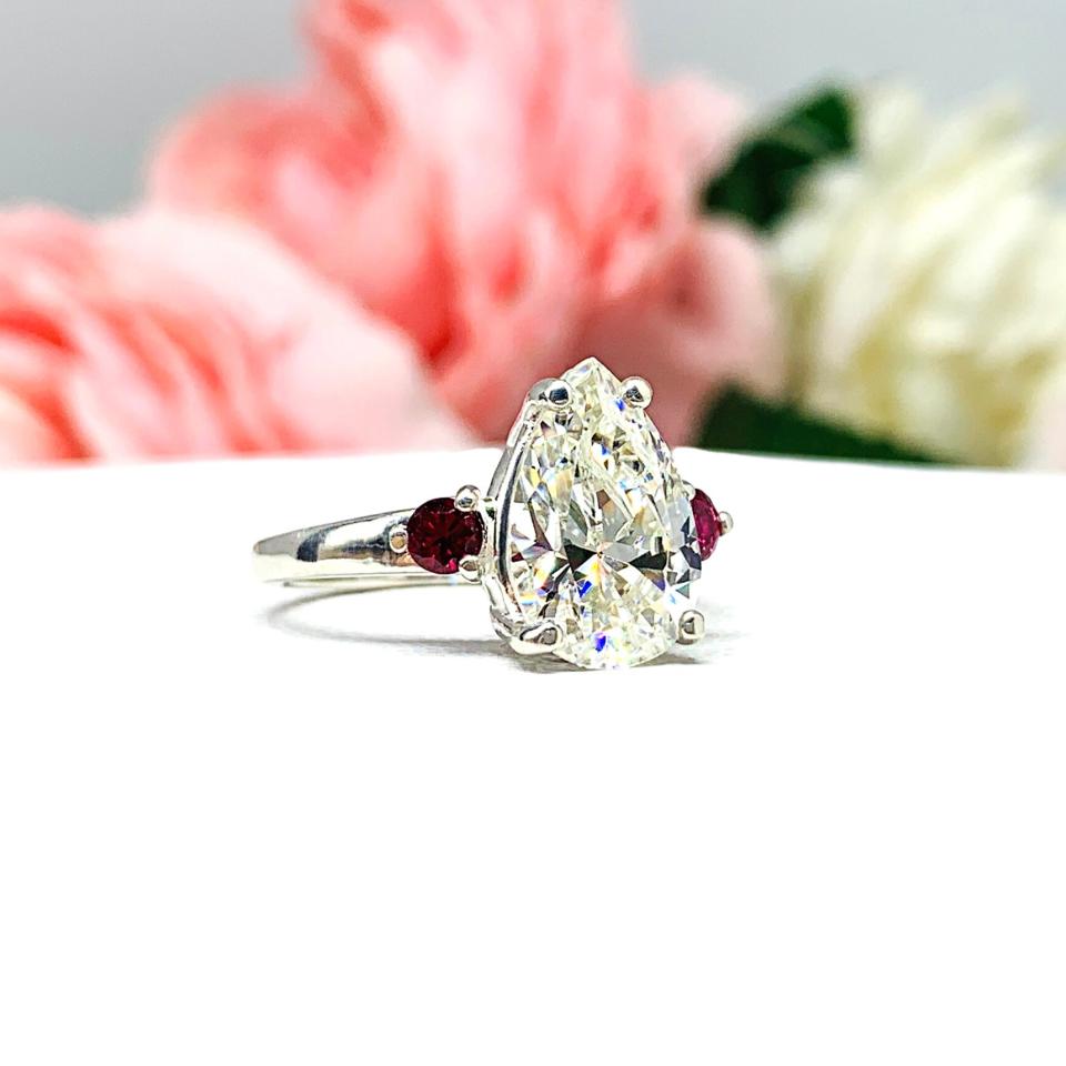 Ruby accent engagement rings top