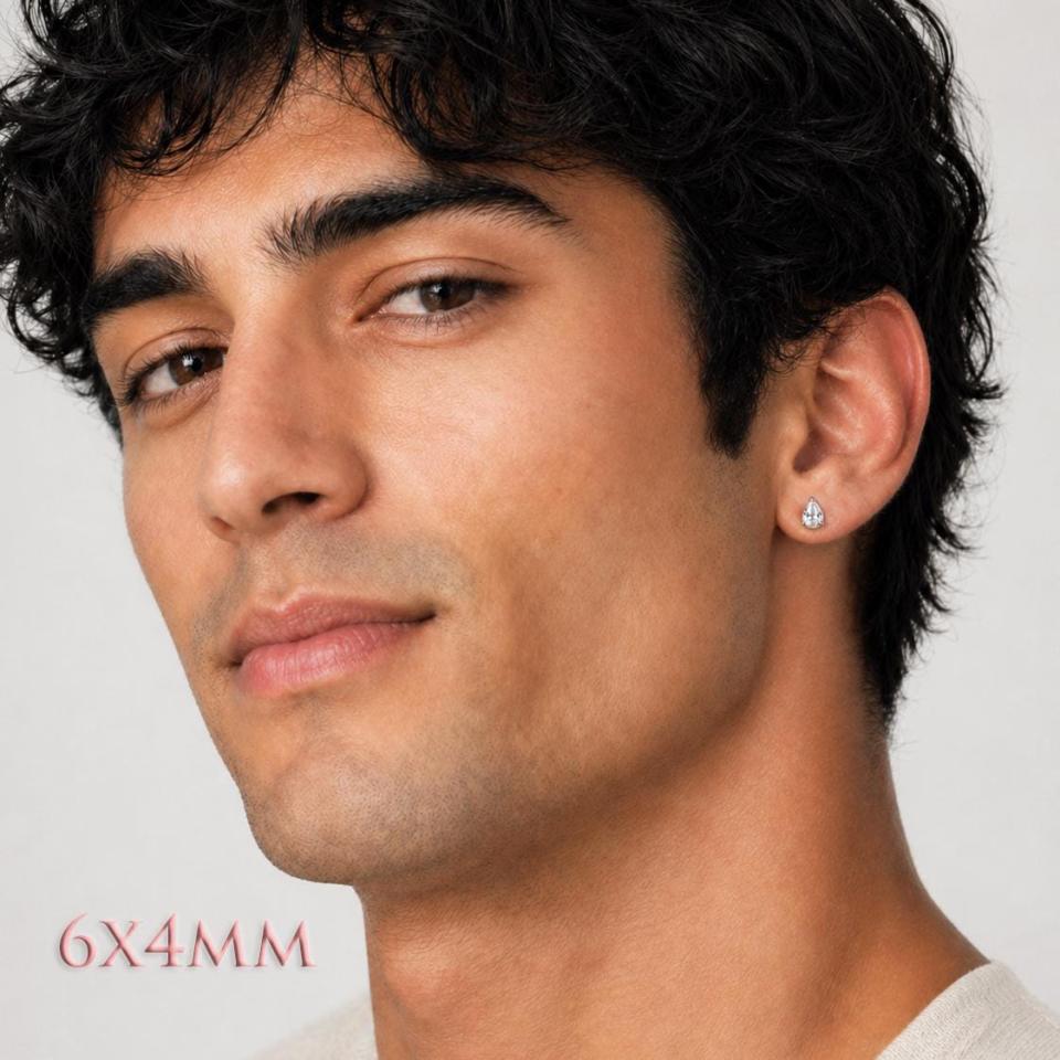 A man wearing 6x4mm pear-cut cz 3-prong stud earrings. Model image for size and styling reference — not a photo of the actual earrings.
