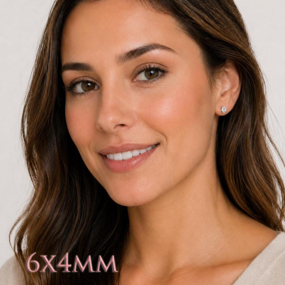 A woman wearing 6x4mm oval cz sterling silver stud earrings. Model image for size and styling reference — not a photo of the actual earrings.