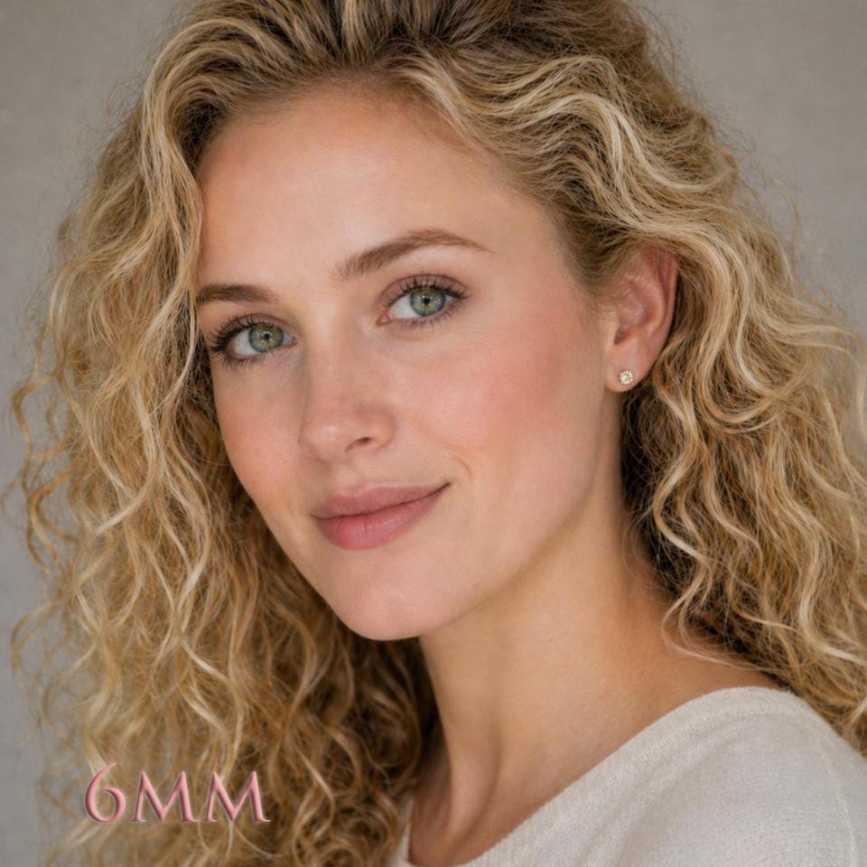 Woman wearing silver four prong basket stud earrings with 6mm light yellow modified Portuguese cut cubic zirconias. Model image for size and styling reference — not a photo of the actual earrings.