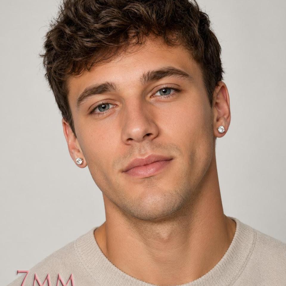 A man wearing a pair of silver stud earrings with 7mm clear round white topaz gemstones. Model image for size and styling reference — not a photo of the actual earrings.