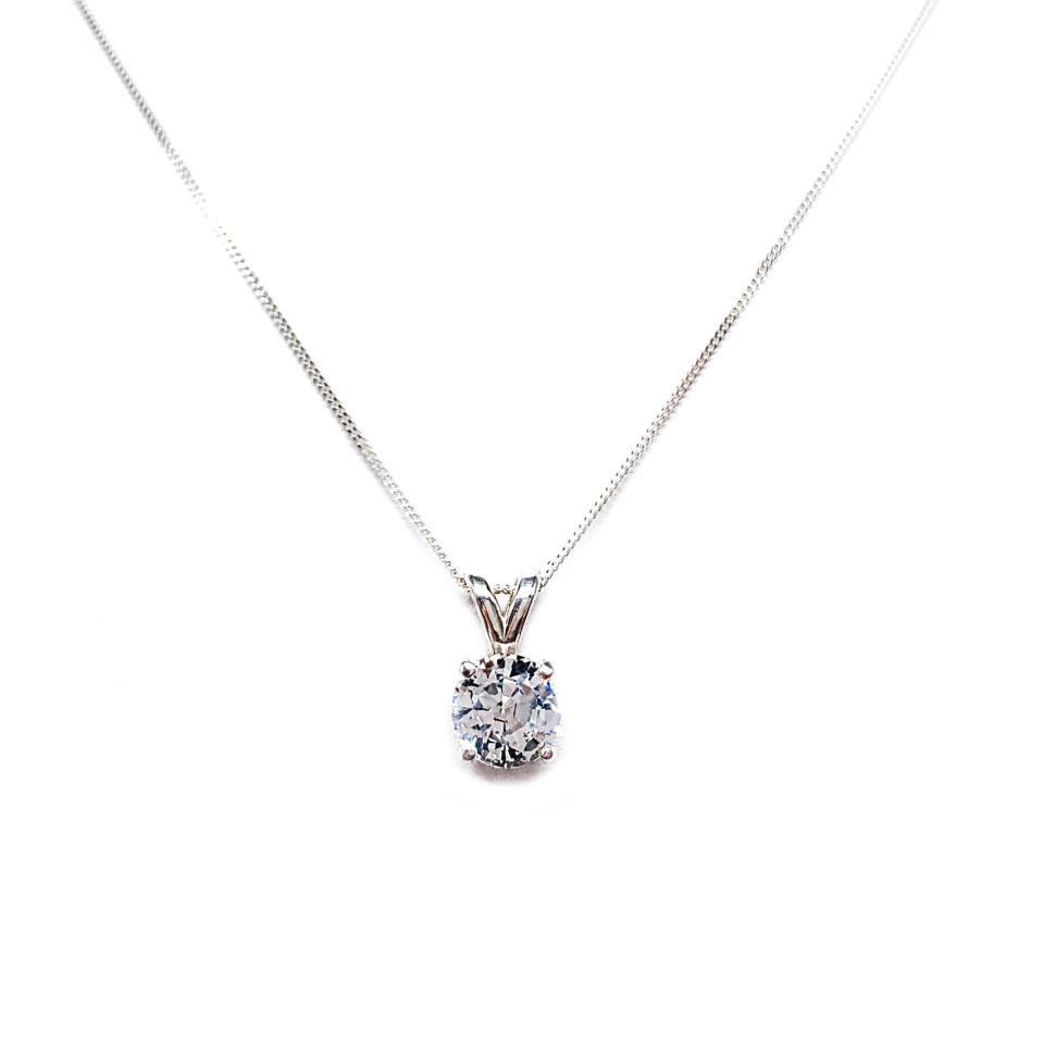 Sterling silver necklace featuring a round mixed-brilliant cut lab-created white sapphire pendant in a 4-prong setting, available in five sizes.