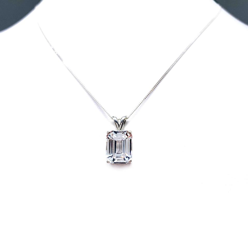 Sterling silver necklace featuring a 12x10mm emerald-cut lab-created white sapphire pendant in a 4-prong setting.