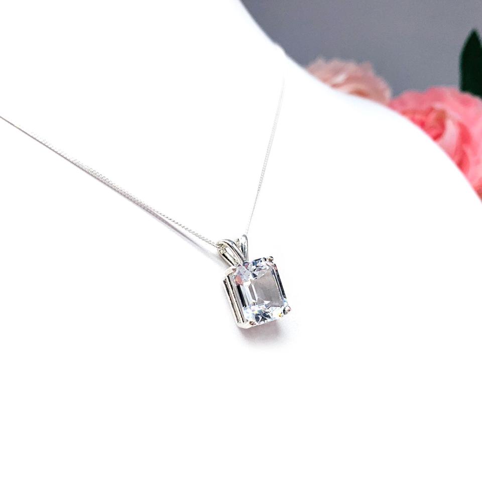 Sterling silver necklace featuring a 12x10mm emerald-cut lab-created white sapphire pendant in a 4-prong setting.