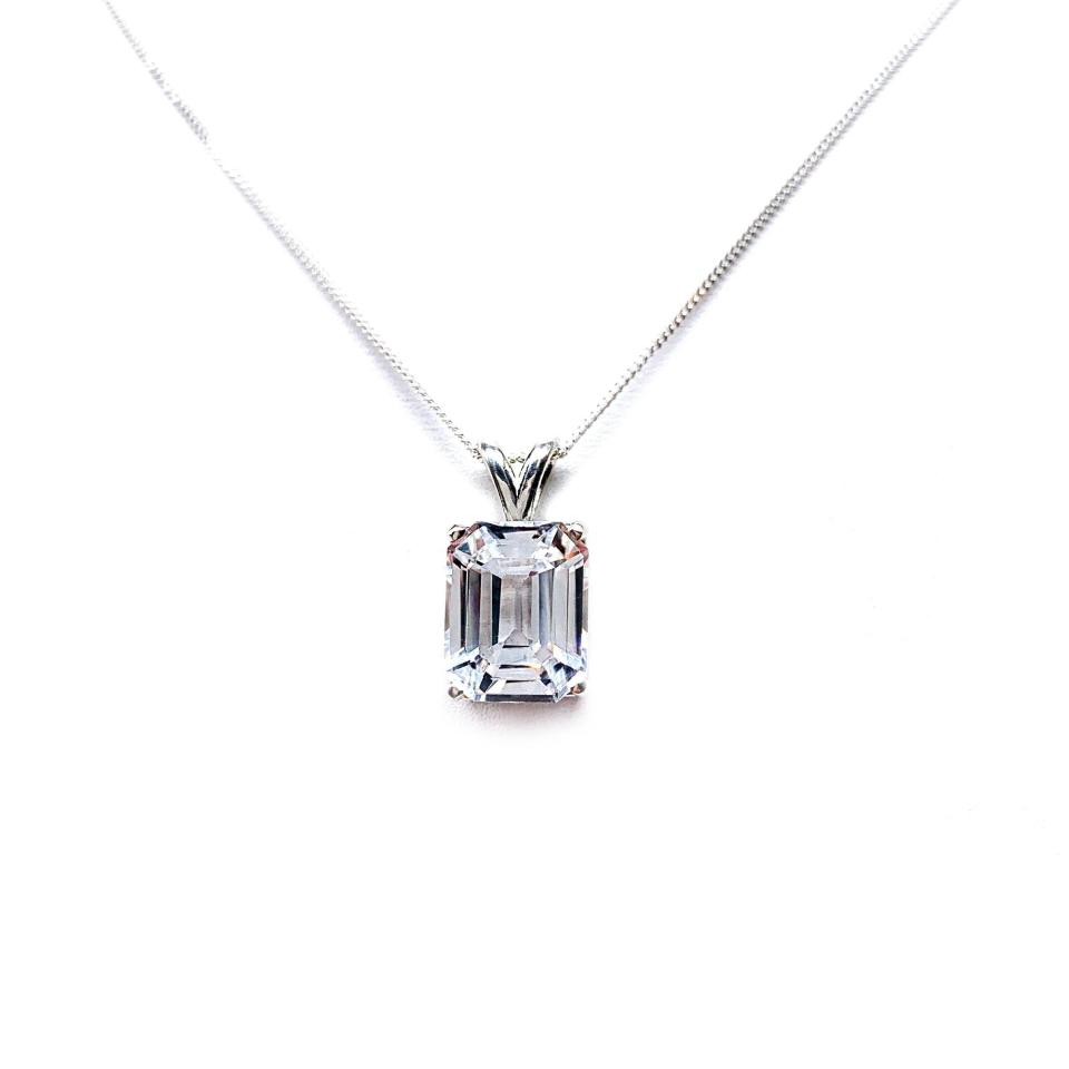 Sterling silver necklace featuring a 12x10mm emerald-cut lab-created white sapphire pendant in a 4-prong setting.
