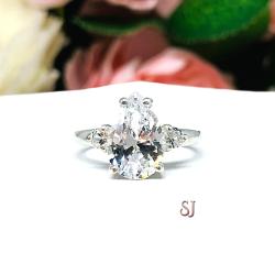 Lab White Sapphire Pear Ring Round Side Stones