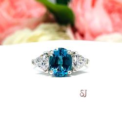 Peacock Blue Teal Color Nanocrystal Oval and CZ Trillion Three Stone Ring