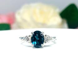 London Blue Topaz Oval Ring – 8x6mm-10x8mm, Moissanite Accents, Sterling Silver, Twist Milgrain Band