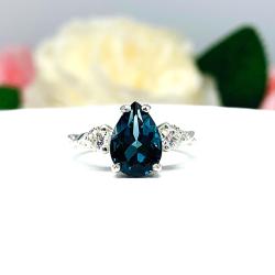 London Blue Topaz Pear Ring – 10x7mm, 12x8mm, Moissanite Accents, Sterling Silver, Twist Milgrain Band