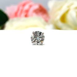 A single white gold four prong basket stud earring with a round brilliant moissanite. The earring is on a white background, facing forward to showcase the sparkling stone.
