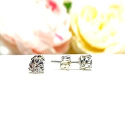 A pair of silver 3-prong basket martini round 'near colorless' or 'G color' cubic zirconia stud earrings. The earrings are shown on a white background with the left earring facing forward showcasing the crisp faceting and clear clarity of the czs, and the right earring facing to the right displaying the center post and butterfly friction clasp.