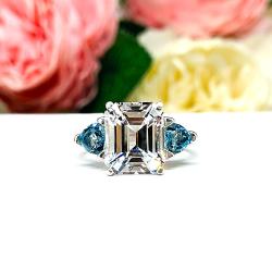 Emerald‑Cut Lab White Sapphire & Swiss Blue Topaz 3‑Stone Ring • 11x9mm, Sterling Silver