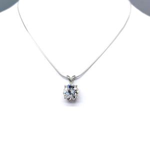 Sterling silver necklace featuring a round lab-created white sapphire pendant in a 4-prong setting, available in five sizes.