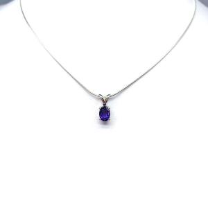 Sterling silver necklace featuring a natural African amethyst pendant in an oval cut, secured by a four-prong setting and displayed on a sterling silver chain.
