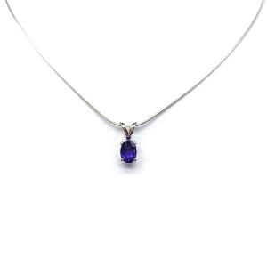 Sterling silver necklace featuring a natural African amethyst pendant in an oval cut, secured by a four-prong setting and displayed on a sterling silver chain.