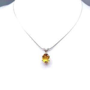 Sterling silver necklace with a 10x8mm oval-cut golden citrine pendant in a 6-prong setting, displayed against a white background.