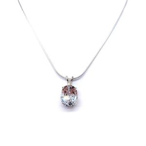 Sterling silver necklace featuring an oval lab-created white sapphire pendant in a 4-prong setting, available in four sizes.