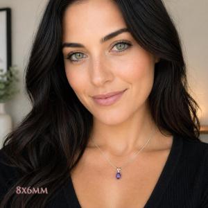 A woman wearing an 8x6mm oval African amethyst sterling silver pendant necklace. Model image for size and styling reference — not a photo of the actual necklace.