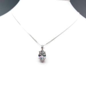 Sterling silver necklace featuring an oval cubic zirconia pendant in a four-prong setting with single bail, shown on a sterling silver chain.