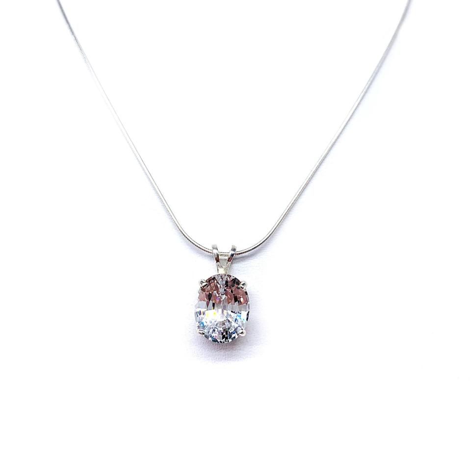 Sterling silver necklace featuring an oval lab-created white sapphire pendant in a 4-prong setting, available in four sizes.