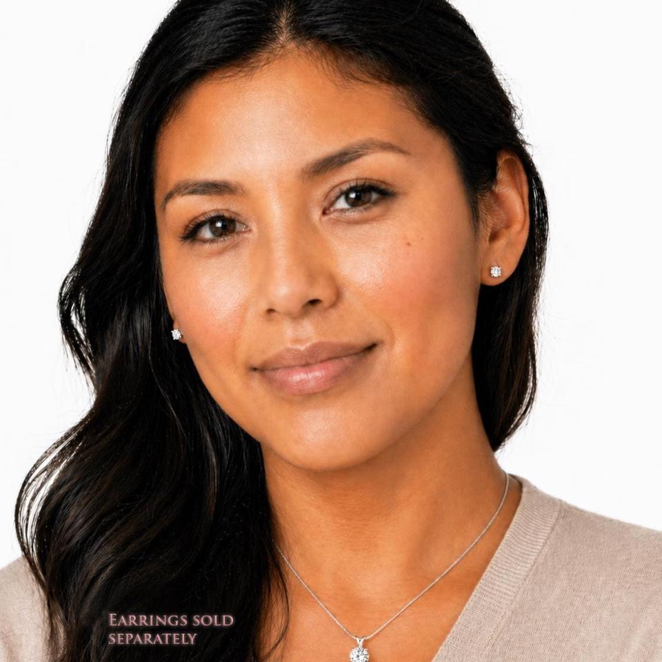 A woman wearing round mixed-brilliant cut lab white sapphire sterling silver stud earrings and matching pendant necklace. The text, 'EARRINGS SOLD SEPARATELY' appears in pink text at the bottom of the image. Model image for size and styling reference — not a photo of the actual jewelry.
