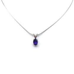 Sterling silver necklace featuring a natural African amethyst pendant in an oval cut, secured by a four-prong setting and displayed on a sterling silver chain.