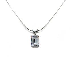 Sterling silver necklace displayed on a white background, featuring a clear emerald-cut cubic zirconia pendant in a four-prong setting suspended from a delicate silver chain.